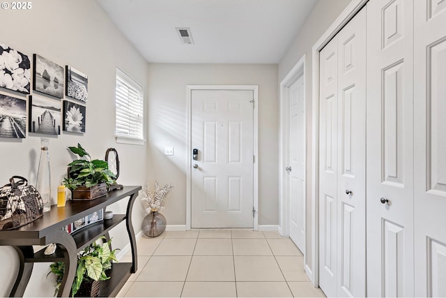 30366 SW Ruth St Unit 70, Wilsonville, OR 97070 - doorway to outside with baseboards, visible vents, and light tile patterned floors