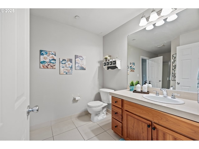 full bath with tile patterned floors, baseboards, vanity, and toilet
