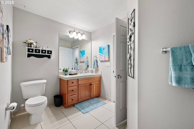 30366 SW Ruth St Unit 70, Wilsonville, OR 97070 - bathroom with toilet, baseboards, tile patterned flooring, and vanity
