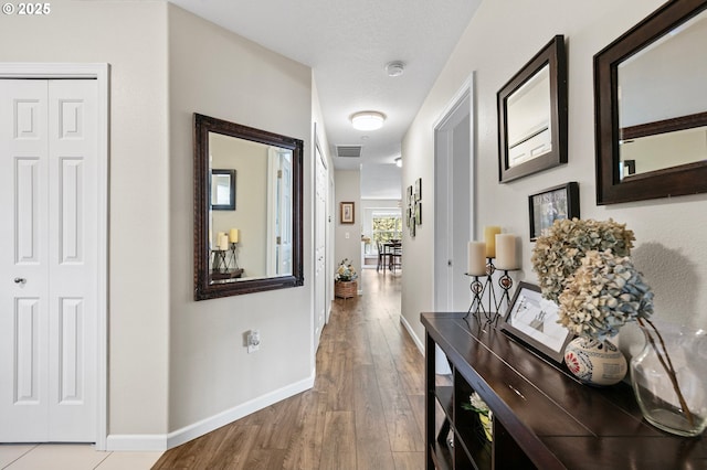 30366 SW Ruth St Unit 70, Wilsonville, OR 97070 - corridor with baseboards, visible vents, and wood finished floors
