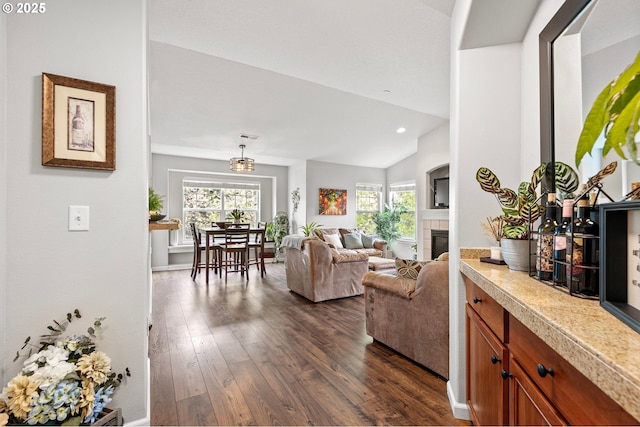 30366 SW Ruth St Unit 70, Wilsonville, OR 97070 - living room featuring a tiled fireplace, plenty of natural light, dark wood finished floors, and lofted ceiling