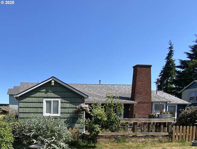 335 Kourt Dr, Eugene, OR 97404 - back of house with a chimney, roof with shingles, and a wooden deck