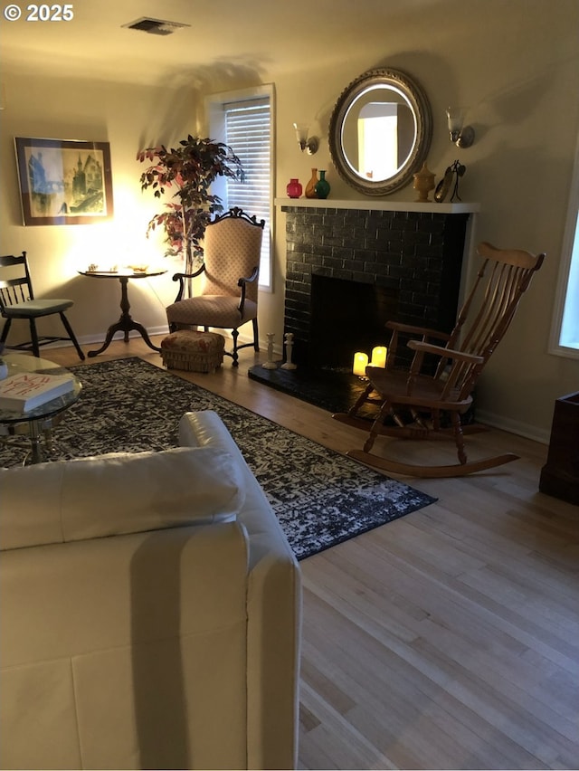 335 Kourt Dr, Eugene, OR 97404 - living area with plenty of natural light, wood finished floors, and a brick fireplace