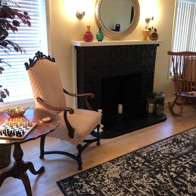 335 Kourt Dr, Eugene, OR 97404 - living area with wood-type flooring and a fireplace