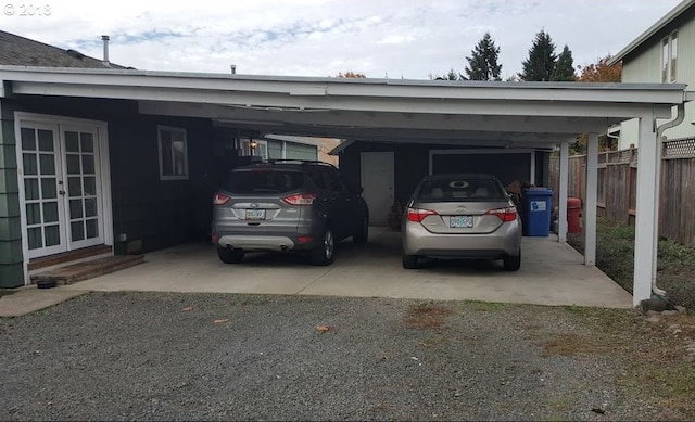 335 Kourt Dr, Eugene, OR 97404 - view of vehicle parking with a carport and french doors