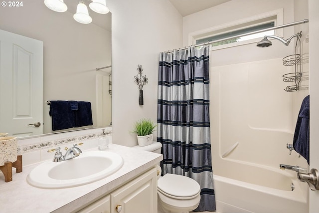 full bathroom with vanity, toilet, and shower / tub combo