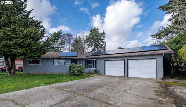 ranch-style home with driveway, a front lawn, an attached garage, crawl space, and solar panels