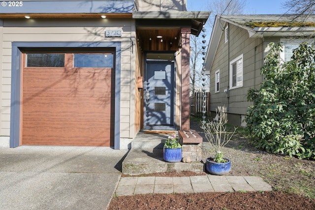 view of exterior entry featuring a garage