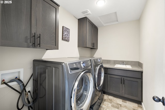3981 N Boomer Dr, Newberg, OR 97132 - laundry area featuring cabinet space, washer and clothes dryer, and stone finish flooring
