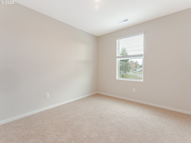 spare room featuring carpet floors