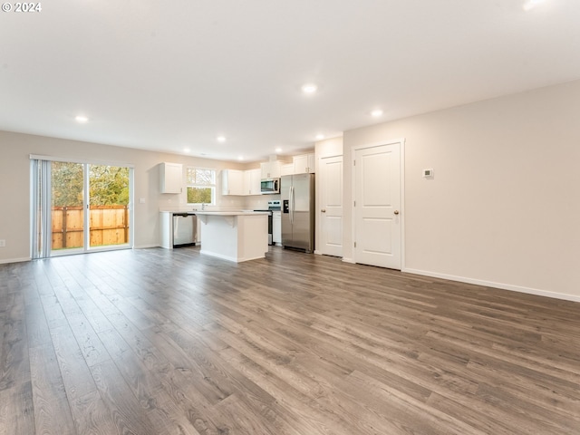 unfurnished living room featuring light hardwood / wood-style flooring