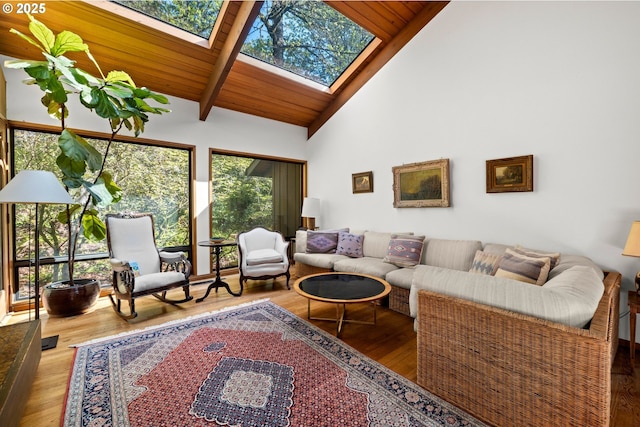 3820 SW Scholls Ferry Rd, Portland, OR 97221 - living area featuring a skylight, high vaulted ceiling, beam ceiling, and wood finished floors