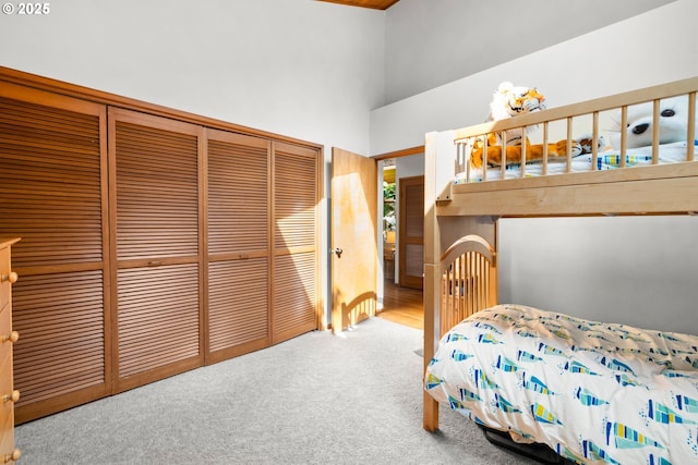 3820 SW Scholls Ferry Rd, Portland, OR 97221 - bedroom featuring a high ceiling, a closet, and carpet flooring