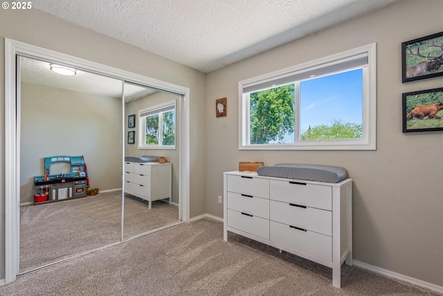 406 Balsa St, La Grande, OR 97850 - carpeted bedroom with a closet, a textured ceiling, and baseboards