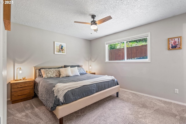 406 Balsa St, La Grande, OR 97850 - carpeted bedroom featuring a textured ceiling, baseboards, and a ceiling fan