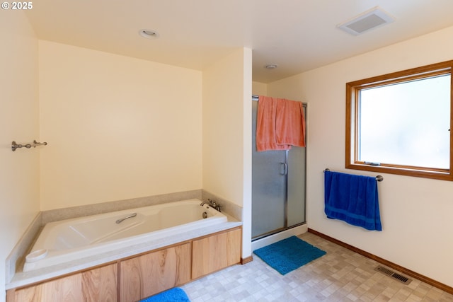 1056 Rock Creek Rd, Goldendale, WA 98620 - bathroom with a bath, a stall shower, and tile patterned floors