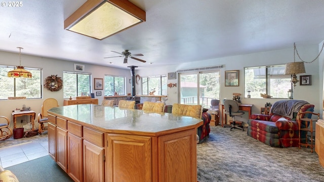 84932 Straw Springs Ln, Milton-Freewater, OR 97862 - kitchen featuring open floor plan, plenty of natural light, a kitchen island, and a ceiling fan