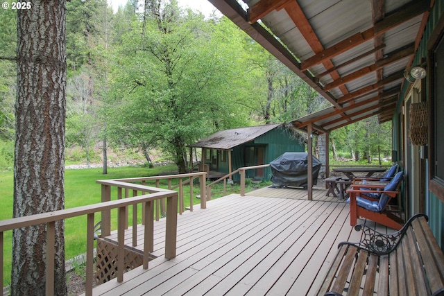 84932 Straw Springs Ln, Milton-Freewater, OR 97862 - wooden terrace featuring a grill, a view of trees, a yard, and an outbuilding