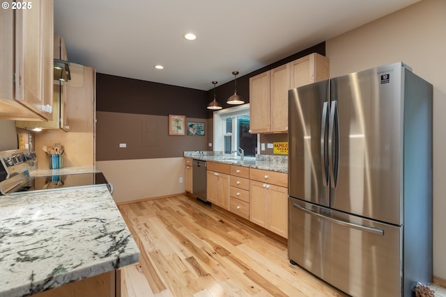 16637 Keasey Rd, Vernonia, OR 97064 - kitchen featuring stainless steel appliances, light brown cabinetry, light wood-style floors, recessed lighting, and decorative light fixtures