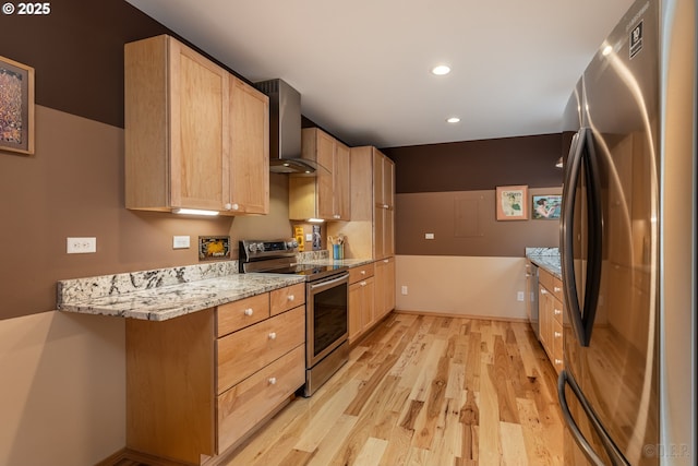 16637 Keasey Rd, Vernonia, OR 97064 - kitchen with appliances with stainless steel finishes, wall chimney exhaust hood, light brown cabinets, light wood finished floors, and recessed lighting