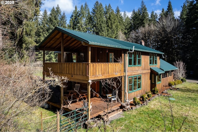 16637 Keasey Rd, Vernonia, OR 97064 - back of property with a metal roof, a chimney, a yard, and a deck