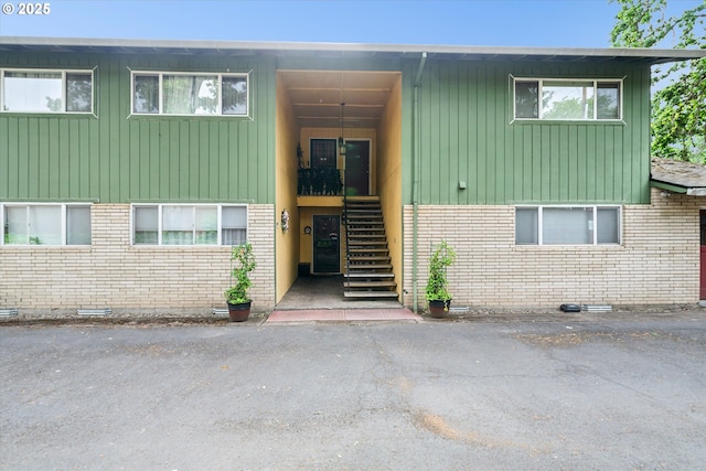 13155 SW Allen Blvd, Beaverton, OR 97005 - doorway to property featuring brick siding and board and batten siding