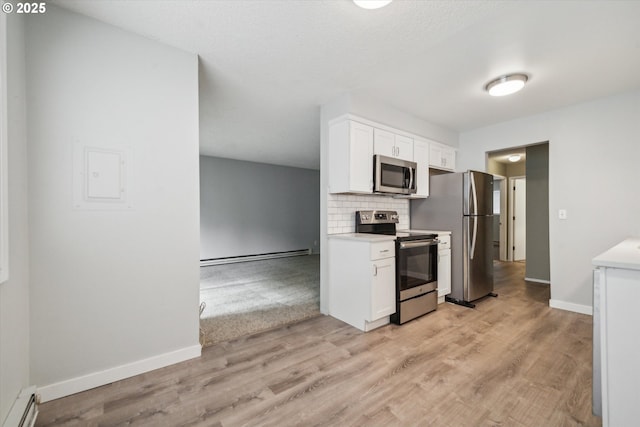 13155 SW Allen Blvd, Beaverton, OR 97005 - kitchen featuring stainless steel appliances, a baseboard radiator, white cabinets, and light countertops