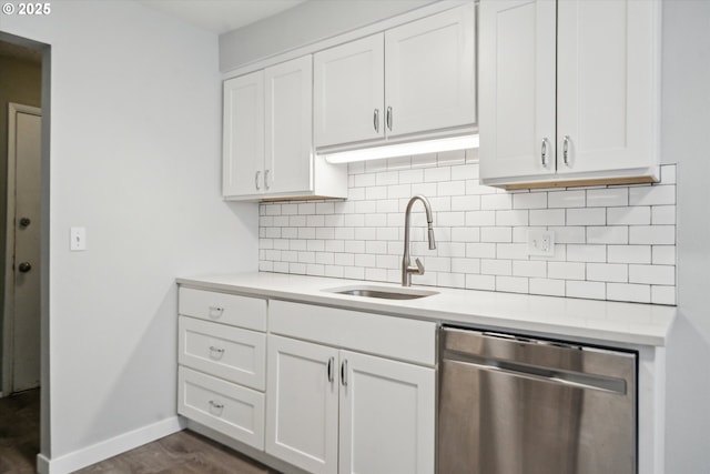 13155 SW Allen Blvd, Beaverton, OR 97005 - kitchen with stainless steel dishwasher, a sink, baseboards, light countertops, and decorative backsplash