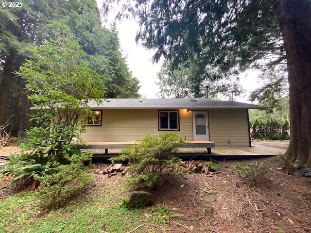 rear view of house with a deck