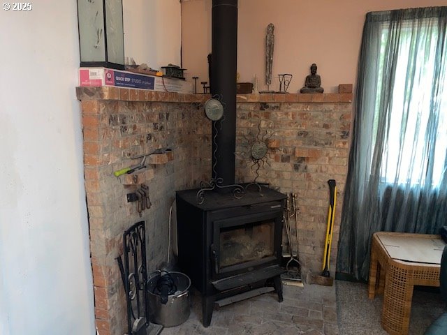 interior details featuring a wood stove