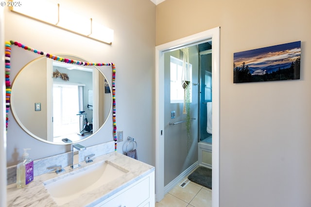 bathroom with vanity, tile patterned floors, and shower / bathtub combination