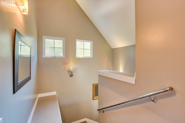 stairs with lofted ceiling