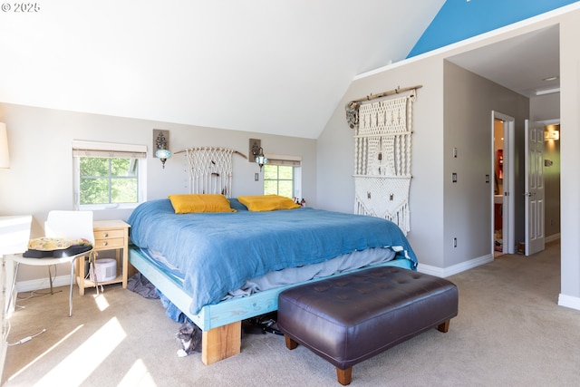 carpeted bedroom featuring lofted ceiling