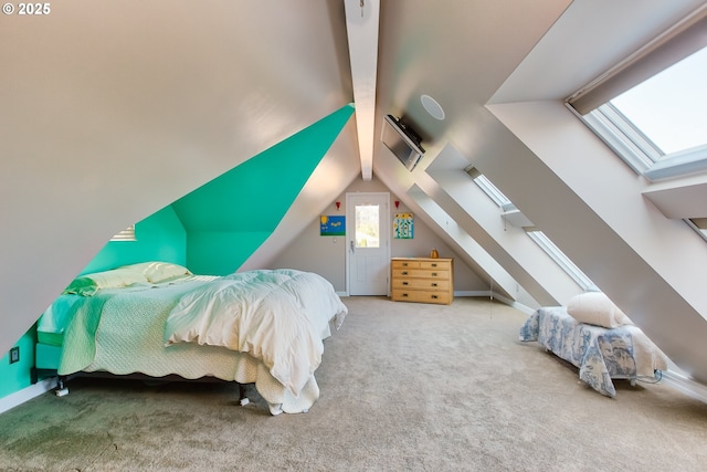 carpeted bedroom with lofted ceiling with skylight