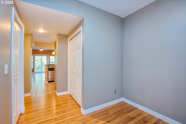 hall with light hardwood / wood-style flooring