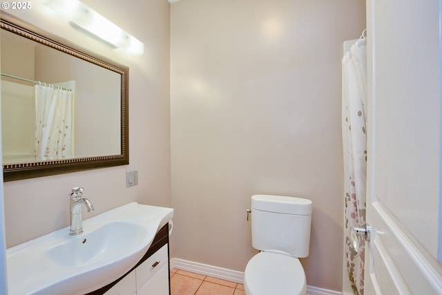 bathroom with vanity, tile patterned floors, and toilet