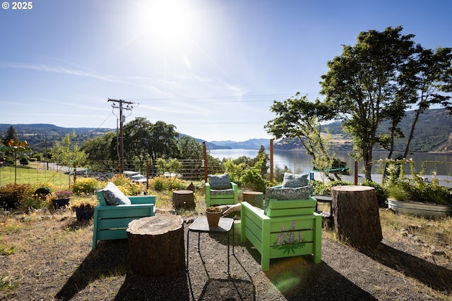 view of home's community featuring a water and mountain view