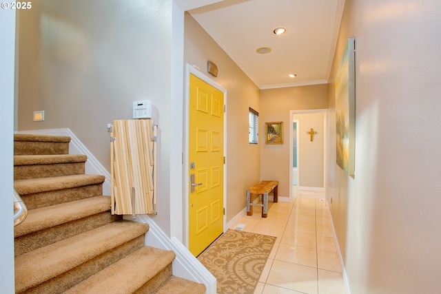 hallway with light tile patterned flooring and crown molding