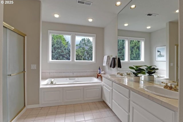 full bathroom with visible vents, a sink, and a healthy amount of sunlight