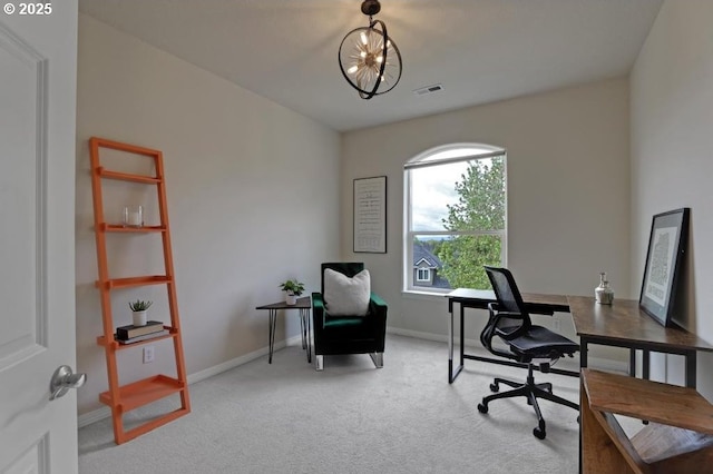 office featuring baseboards, visible vents, and light colored carpet