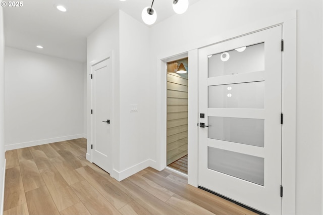 entrance foyer featuring recessed lighting, baseboards, and light wood-style floors