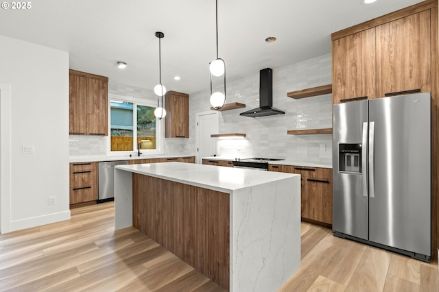 kitchen with open shelves, a sink, appliances with stainless steel finishes, wall chimney exhaust hood, and modern cabinets