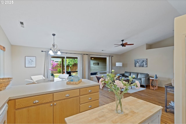 1218 Mt View Ln, Molalla, OR 97038 - dining room featuring lofted ceiling, light wood finished floors, ceiling fan, and a chandelier