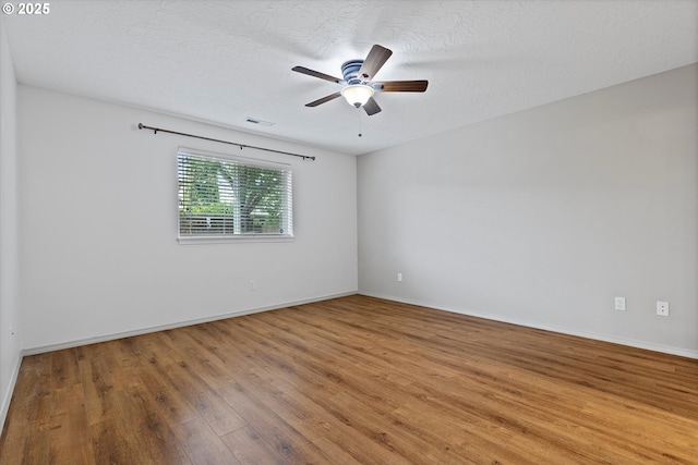 1218 Mt View Ln, Molalla, OR 97038 - spare room featuring wood finished floors, a ceiling fan, and a textured ceiling