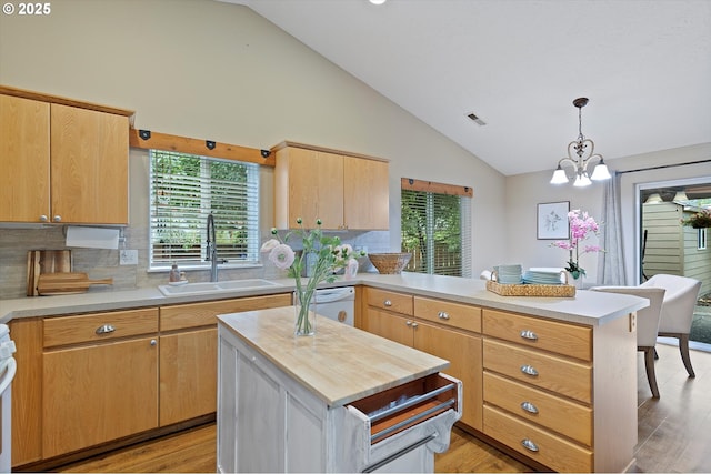 1218 Mt View Ln, Molalla, OR 97038 - kitchen featuring a peninsula, white dishwasher, healthy amount of natural light, backsplash, and high vaulted ceiling