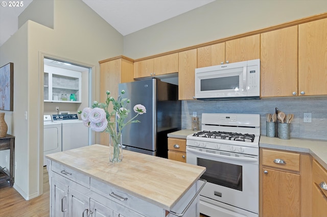 1218 Mt View Ln, Molalla, OR 97038 - kitchen with white appliances, independent washer and dryer, decorative backsplash, light wood-type flooring, and butcher block counters