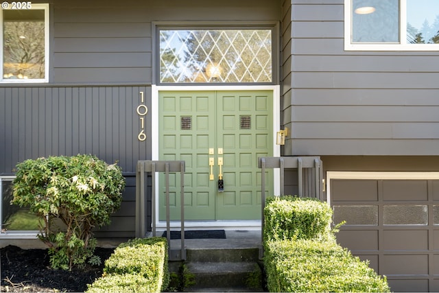 entrance to property featuring a garage