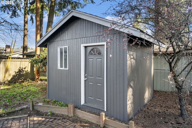 view of shed with fence