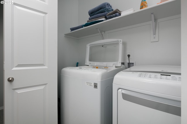 laundry room featuring washer and clothes dryer