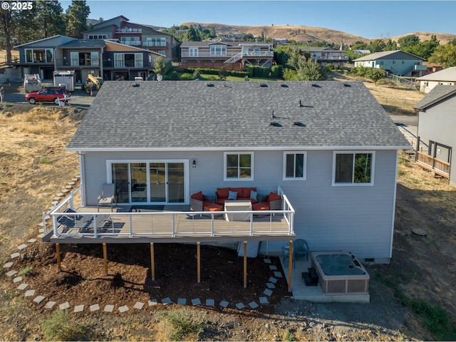 back of house featuring an outdoor hangout area, a deck with mountain view, and a patio